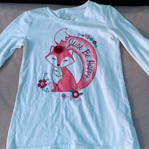 I am selling a white shirt with a fox on it